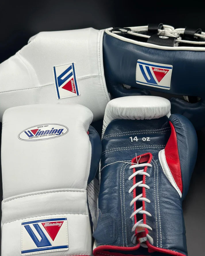 Pair of boxing gloves with visible branding on a dark background